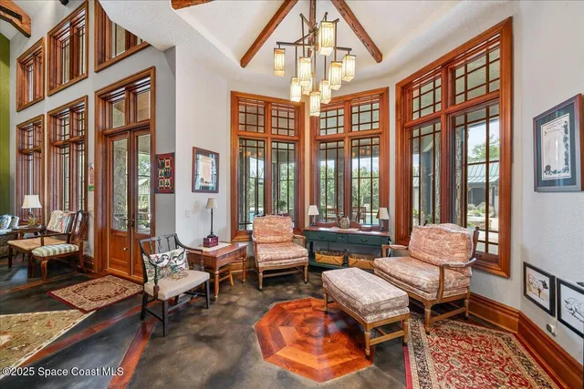 a view of a dining room with furniture window and outside view