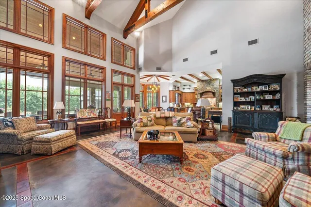 a bedroom with two beds and a window