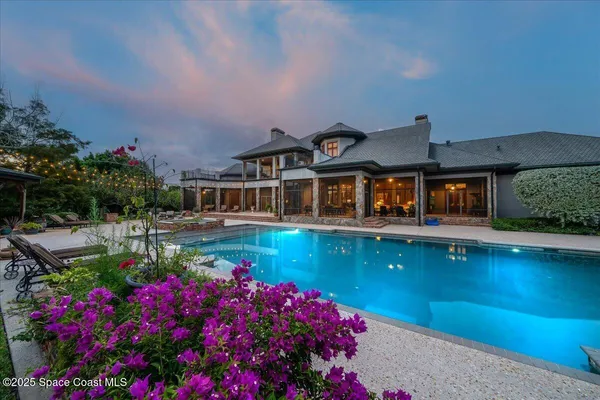 an aerial view of residential house with outdoor space and parking
