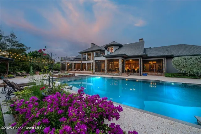 an aerial view of residential house with outdoor space and parking