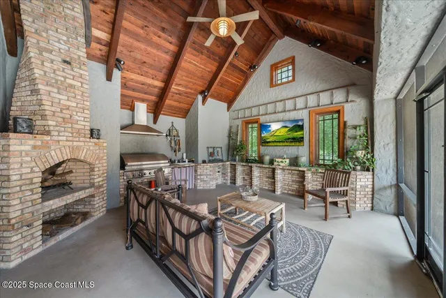 an aerial view of residential houses with outdoor space and swimming pool