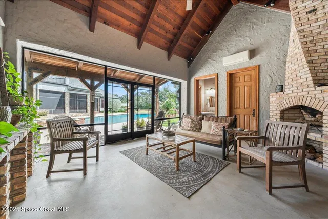 an aerial view of residential houses with outdoor space and river