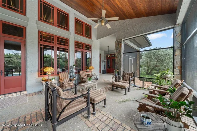 an aerial view of residential building with outdoor space and lake view