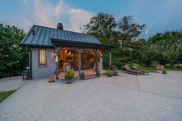 an aerial view of residential house with outdoor space and swimming pool