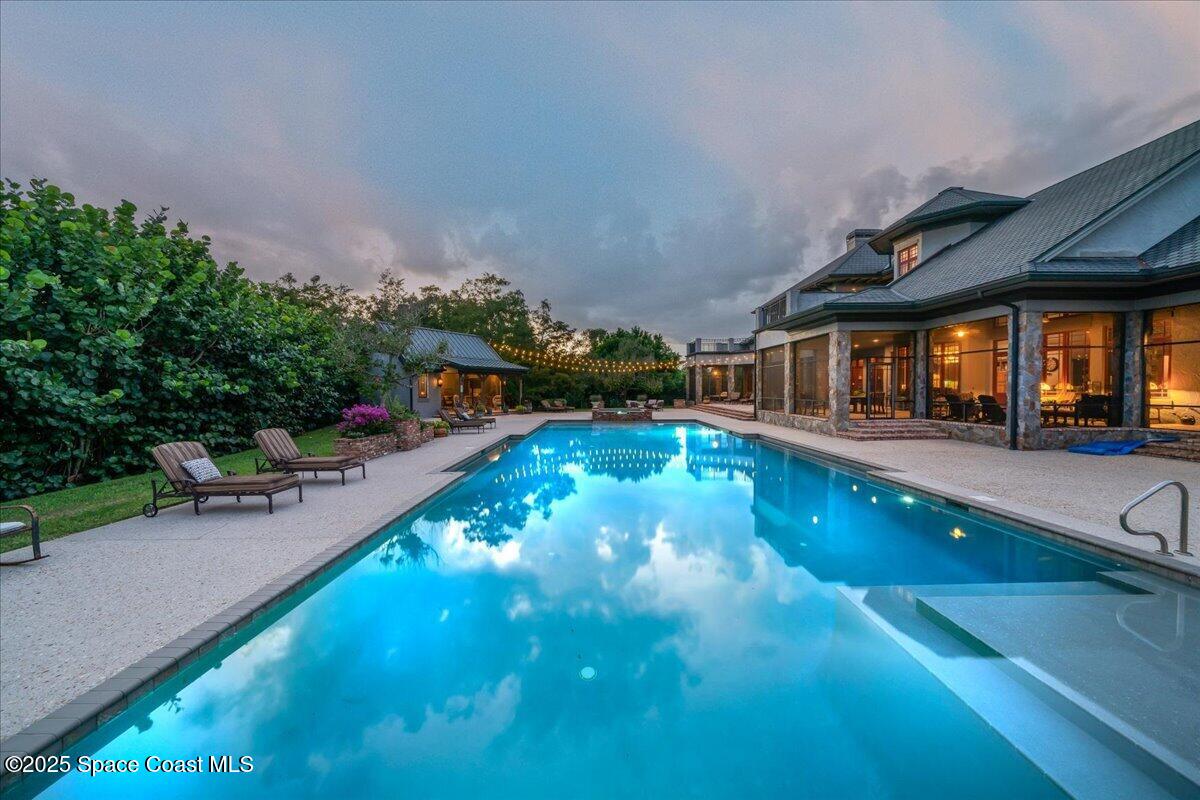 586 Wethersfield Place Melbourne, FL 32940 - Photo 51 of 112 a view of a swimming pool with an outdoor seating