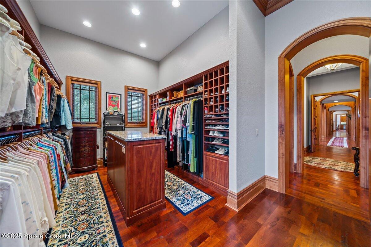 586 Wethersfield Place Melbourne, FL 32940 - Photo 69 of 112 a view of walk in closet with clothes and shoes