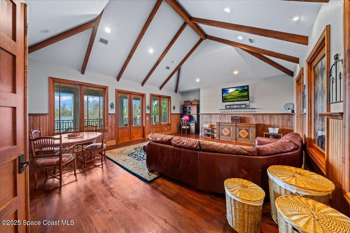 586 Wethersfield Place Melbourne, FL 32940 - Photo 76 of 112 a living room with furniture and a wooden floor