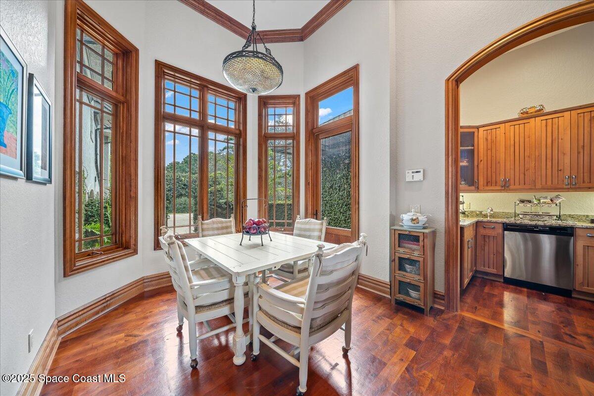 586 Wethersfield Place Melbourne, FL 32940 - Photo 86 of 112 a view of a dining room with furniture window and wooden floor
