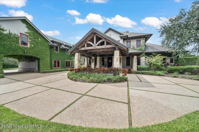 a dining room with furniture and chandelier