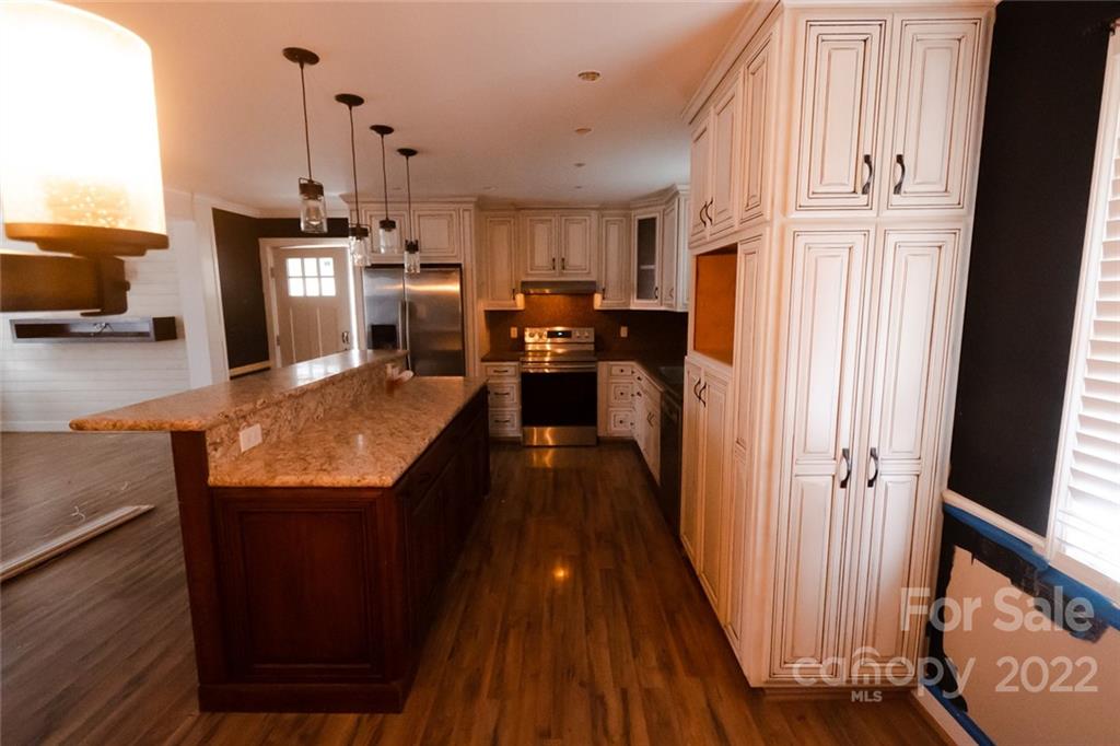 20450 Indian Mound Road Albemarle, NC 28001 - Photo 4 of 14 a view of a kitchen from the hallway