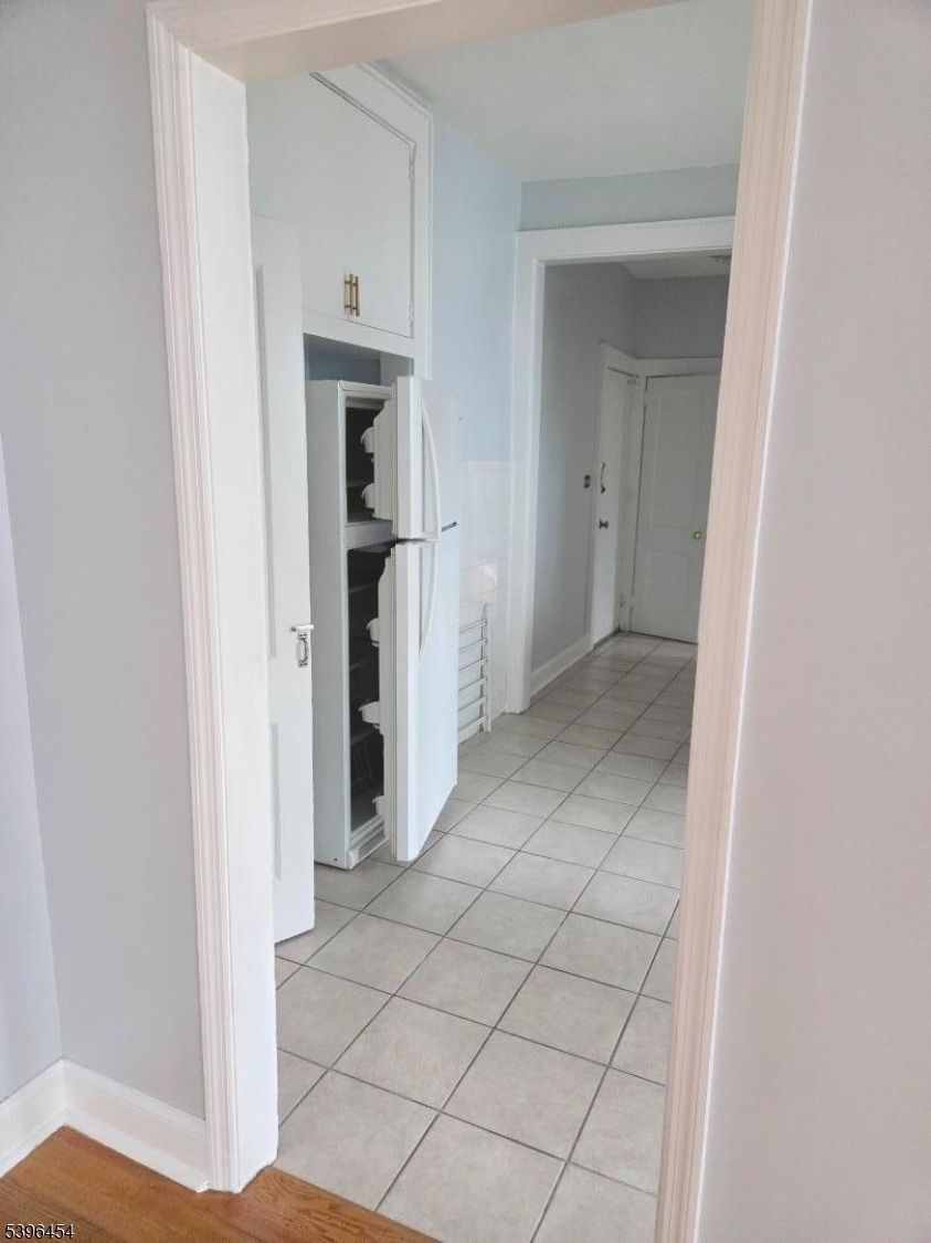 292 Leslie Street, Unit 1R Newark, NJ 07112 - Photo 7 of 9 a view of a hallway with closet