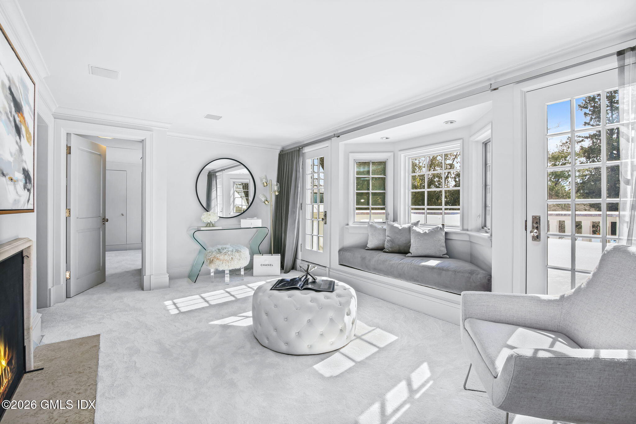 164 Round Hill Road Greenwich, CT 06831 - Photo 25 of 67 a living room with furniture and a large window