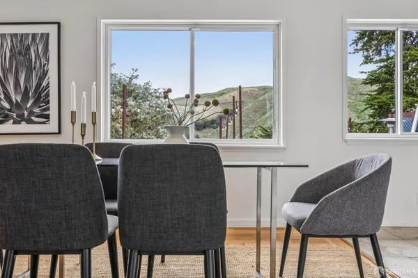 a view of a livingroom with furniture and a window