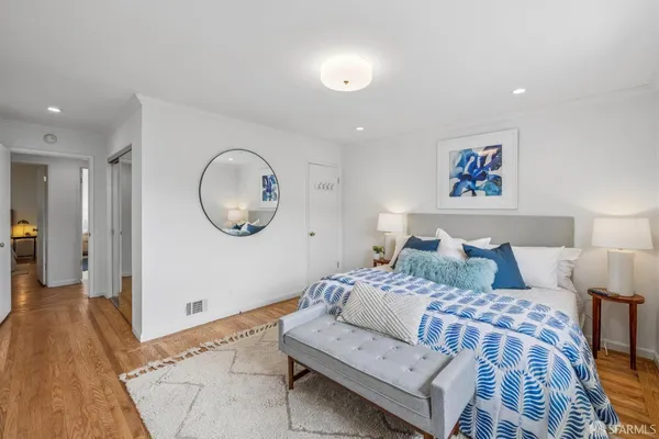 a bedroom with a bed and a table