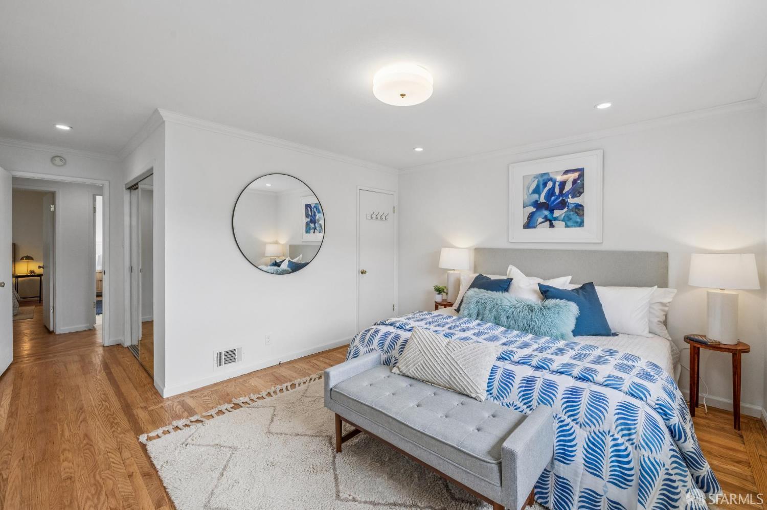 545 Talbot Avenue Pacifica, CA 94044 - Photo 37 of 87 a bedroom with a large bed and a chandelier