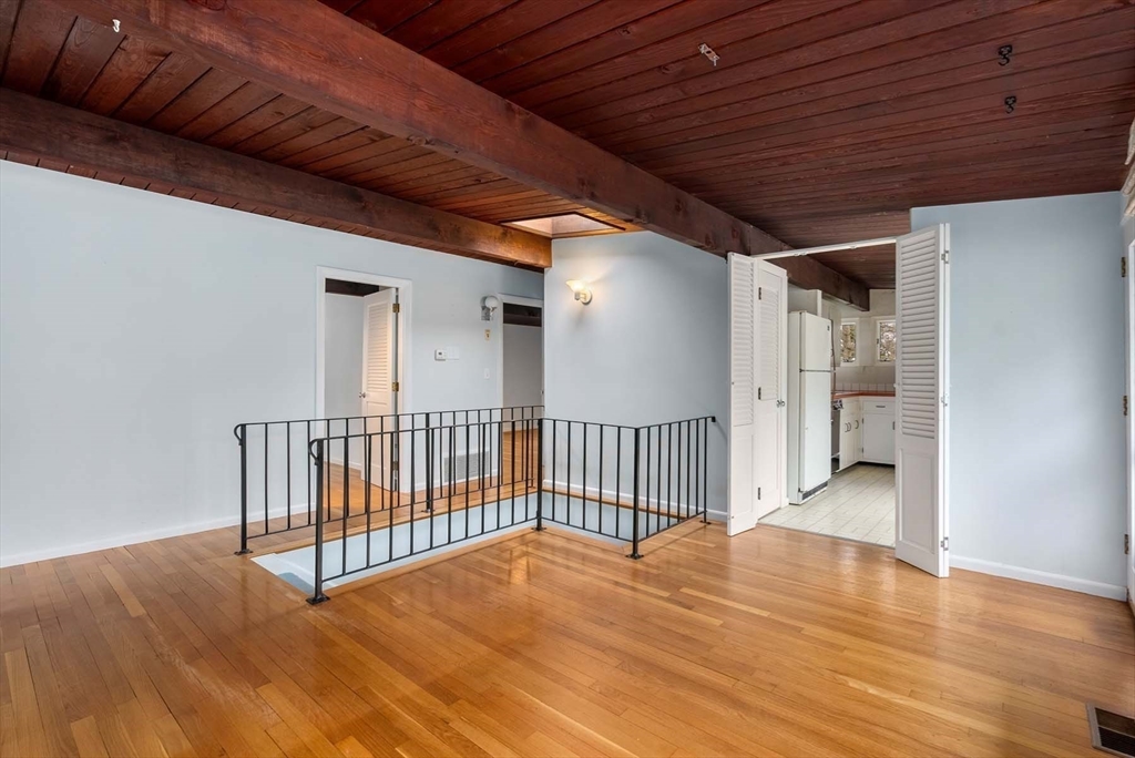34 Bellingham Road Brookline, MA 02467 - Photo 19 of 33 a view of a room with wooden floor