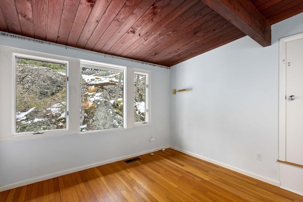 34 Bellingham Road Brookline, MA 02467 - Photo 25 of 33 a view of empty room with wooden floor and fan
