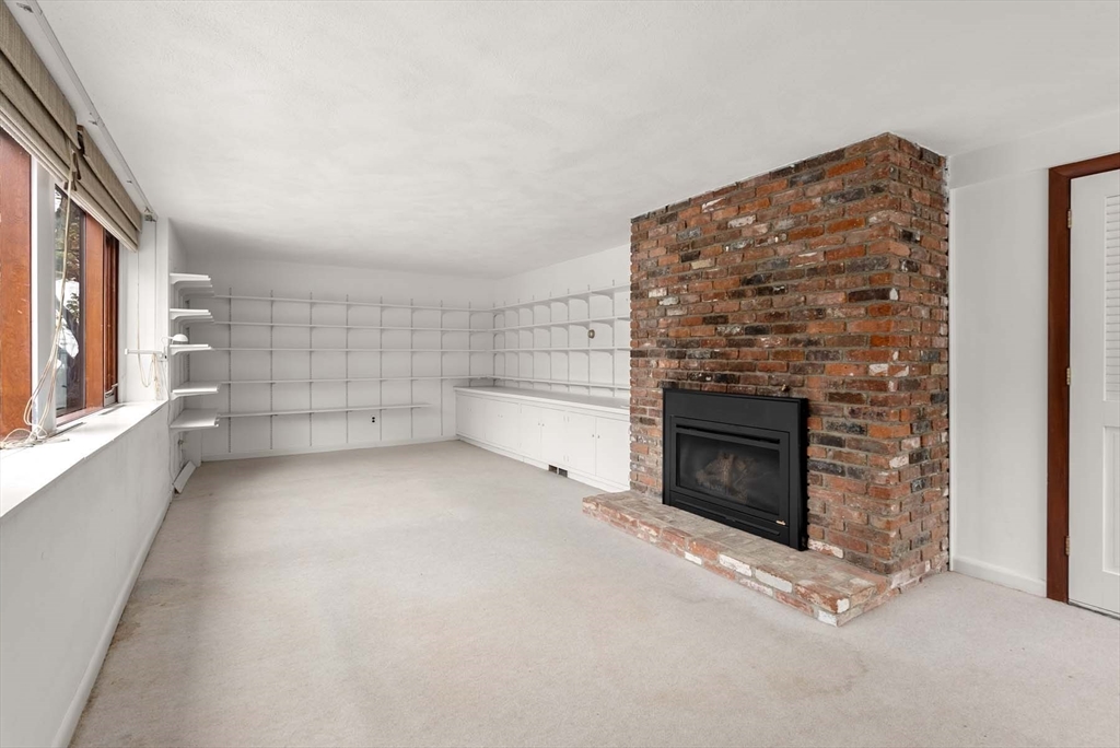 34 Bellingham Road Brookline, MA 02467 - Photo 29 of 33 a view of an empty room with a fireplace