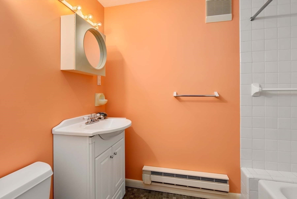 34 Bellingham Road Brookline, MA 02467 - Photo 32 of 33 a bathroom with a sink a toilet and shower