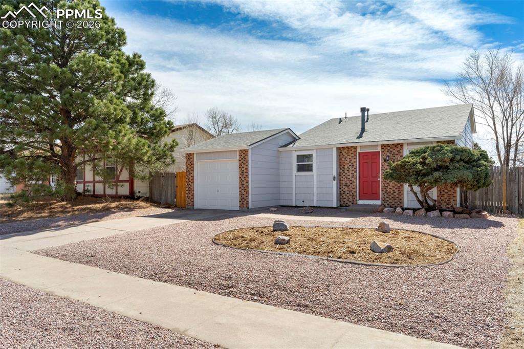 6745 Parkridge Court Colorado Springs, CO 80915 - Photo 1 of 23 a front view of a house with a yard