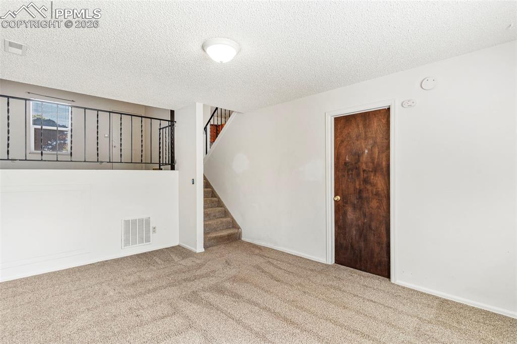 6745 Parkridge Court Colorado Springs, CO 80915 - Photo 12 of 23 an entryway of a house and an empty room