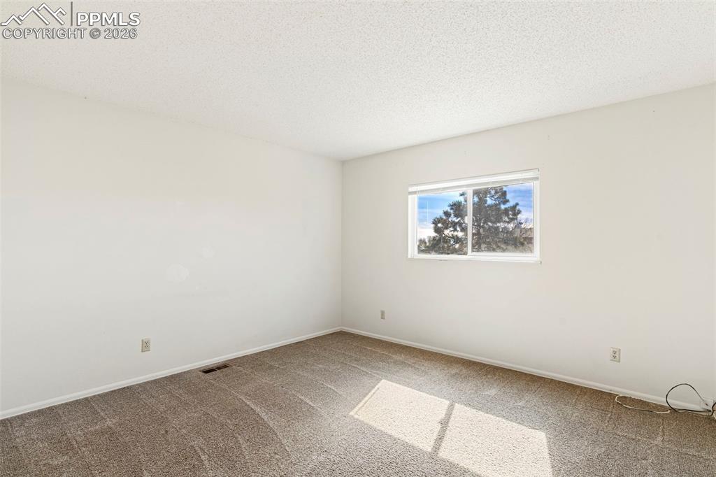 6745 Parkridge Court Colorado Springs, CO 80915 - Photo 14 of 23 an empty room with a window