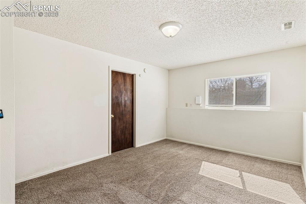 6745 Parkridge Court Colorado Springs, CO 80915 - Photo 20 of 23 a view of an empty room with a window