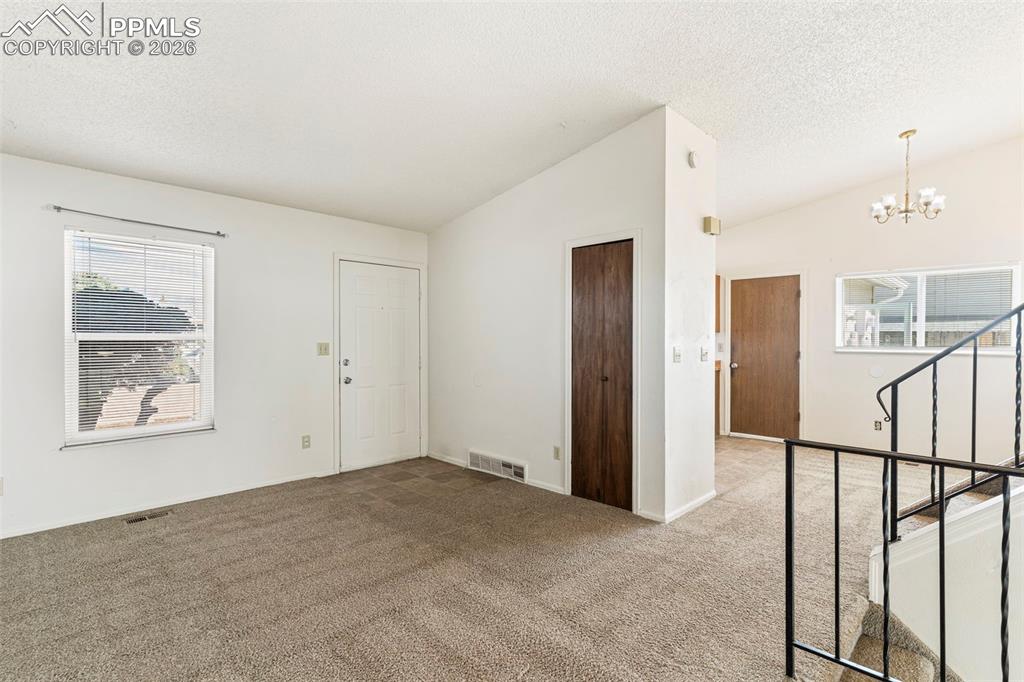 6745 Parkridge Court Colorado Springs, CO 80915 - Photo 2 of 23 a view of an empty room with a window