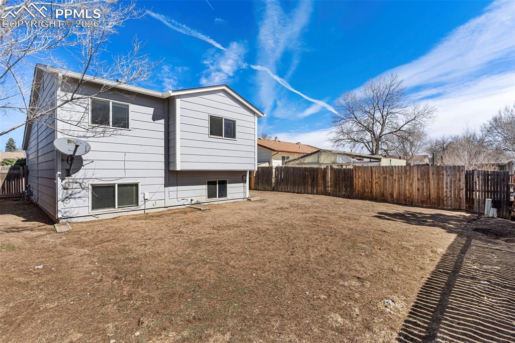 6745 Parkridge Court Colorado Springs, CO 80915 - Photo 21 of 23 a backyard of a house