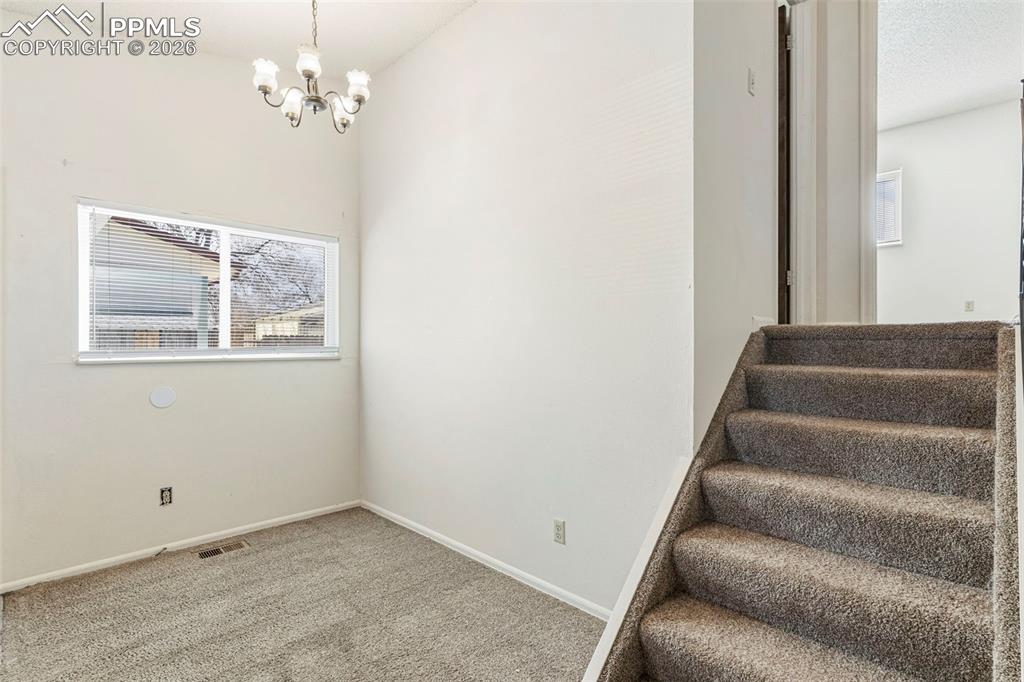 6745 Parkridge Court Colorado Springs, CO 80915 - Photo 6 of 23 a view of entryway with wooden floor