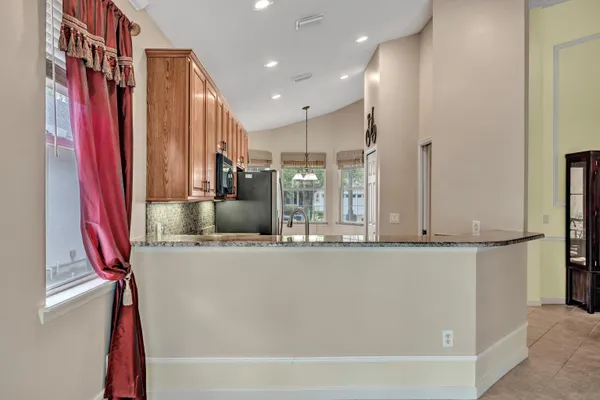 a view of a house with backyard and garden