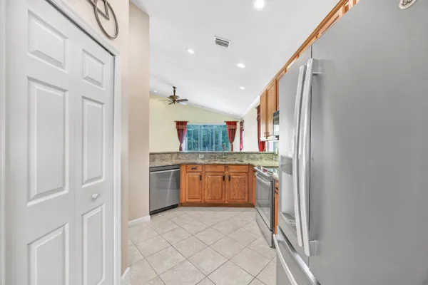 a view of multiple house with palm tree