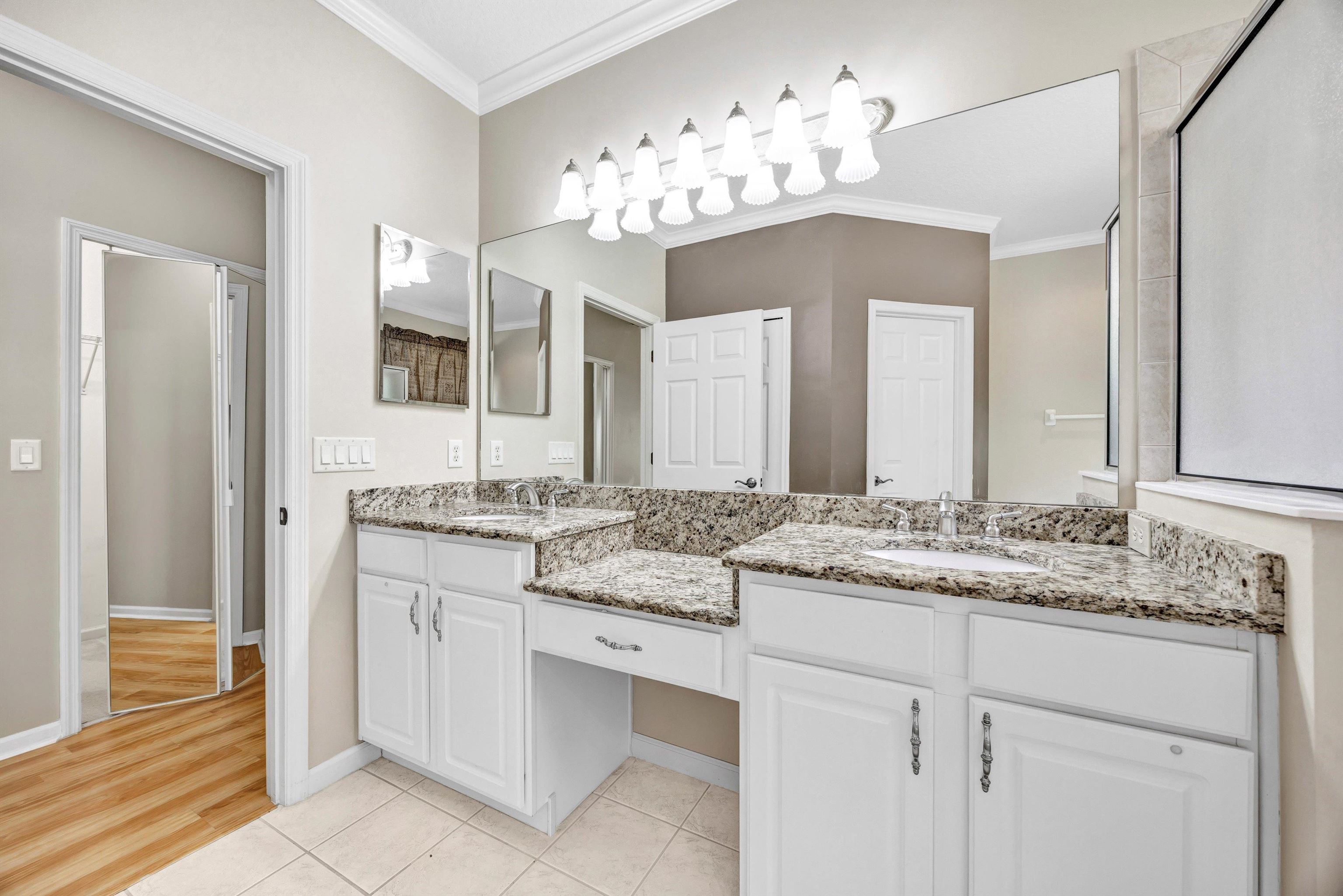 608 Copperhead Circle St. Augustine, FL 32092 - Photo 25 of 65 This photo depicts the large double sink vanity area, with showcase lighting.