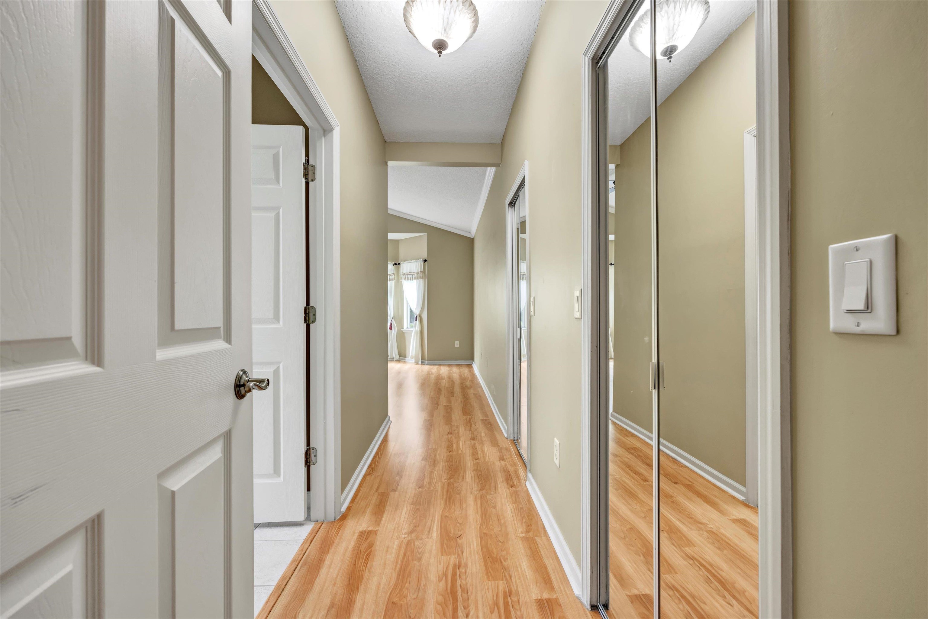 608 Copperhead Circle St. Augustine, FL 32092 - Photo 28 of 65 Two spacious walk-in closets with mirrored doors along the hallway, all tastefully located in relation to the bath.