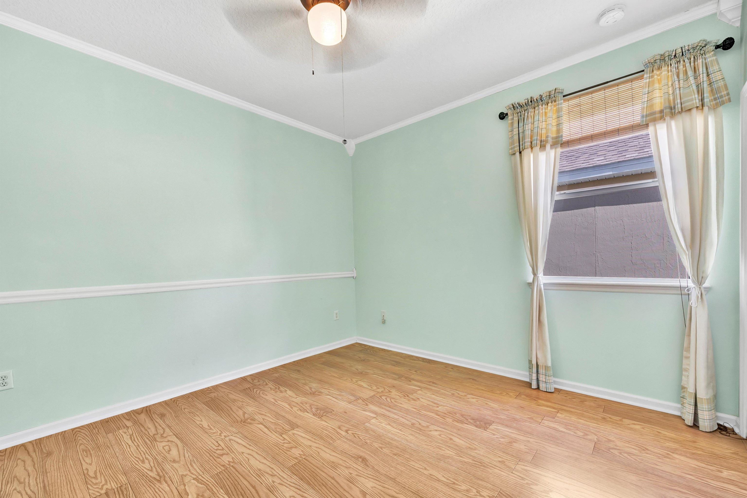 608 Copperhead Circle St. Augustine, FL 32092 - Photo 34 of 65 a view of an empty room with wooden floor and a window