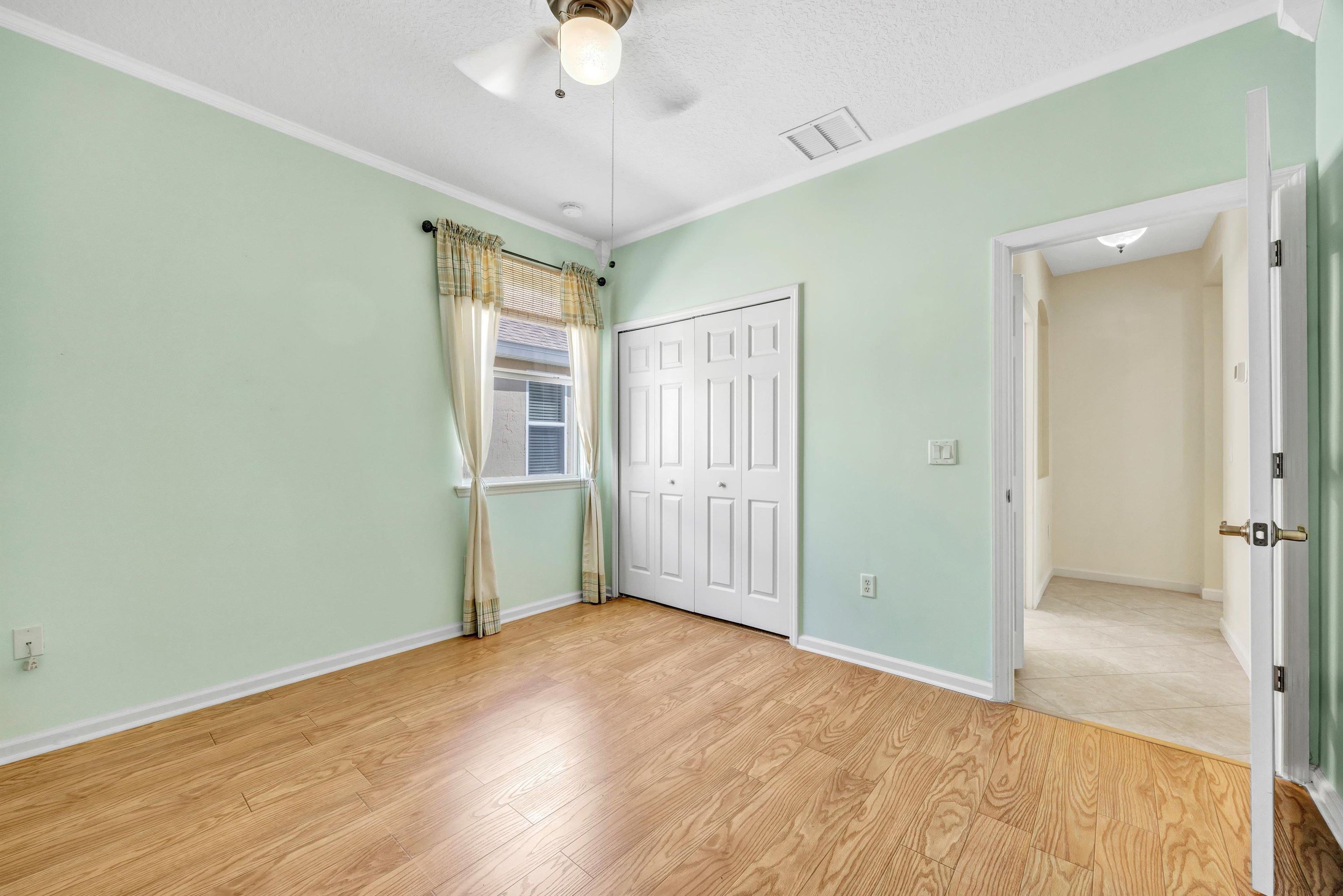 608 Copperhead Circle St. Augustine, FL 32092 - Photo 35 of 65 The third bedroom has a wast facing window. Plenty cozy with large closet and lovely hardwood floors.