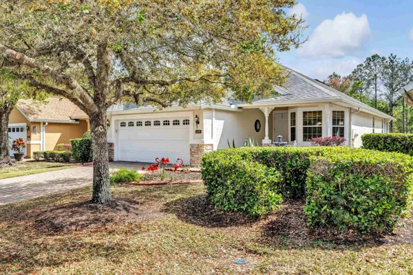 a view of a room with furniture and a ceiling fan