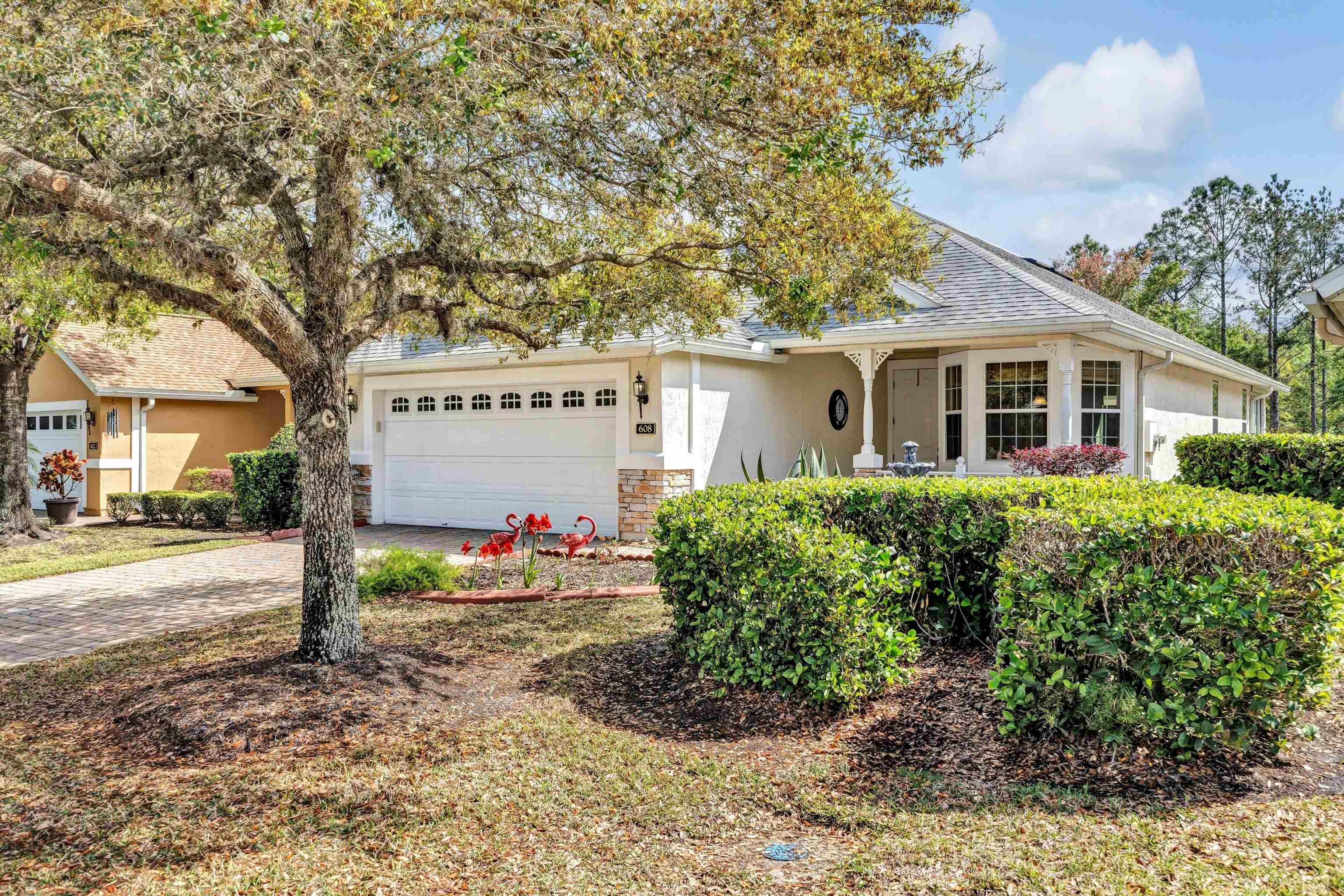 608 Copperhead Circle St. Augustine, FL 32092 - Photo 4 of 65 Shows lovely alcove porch and waterfall treatment. The front of the house faces South, creating even exposure over the house throughout the day, no matter what the season.