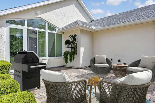 a view of a living room and a kitchen with a sink