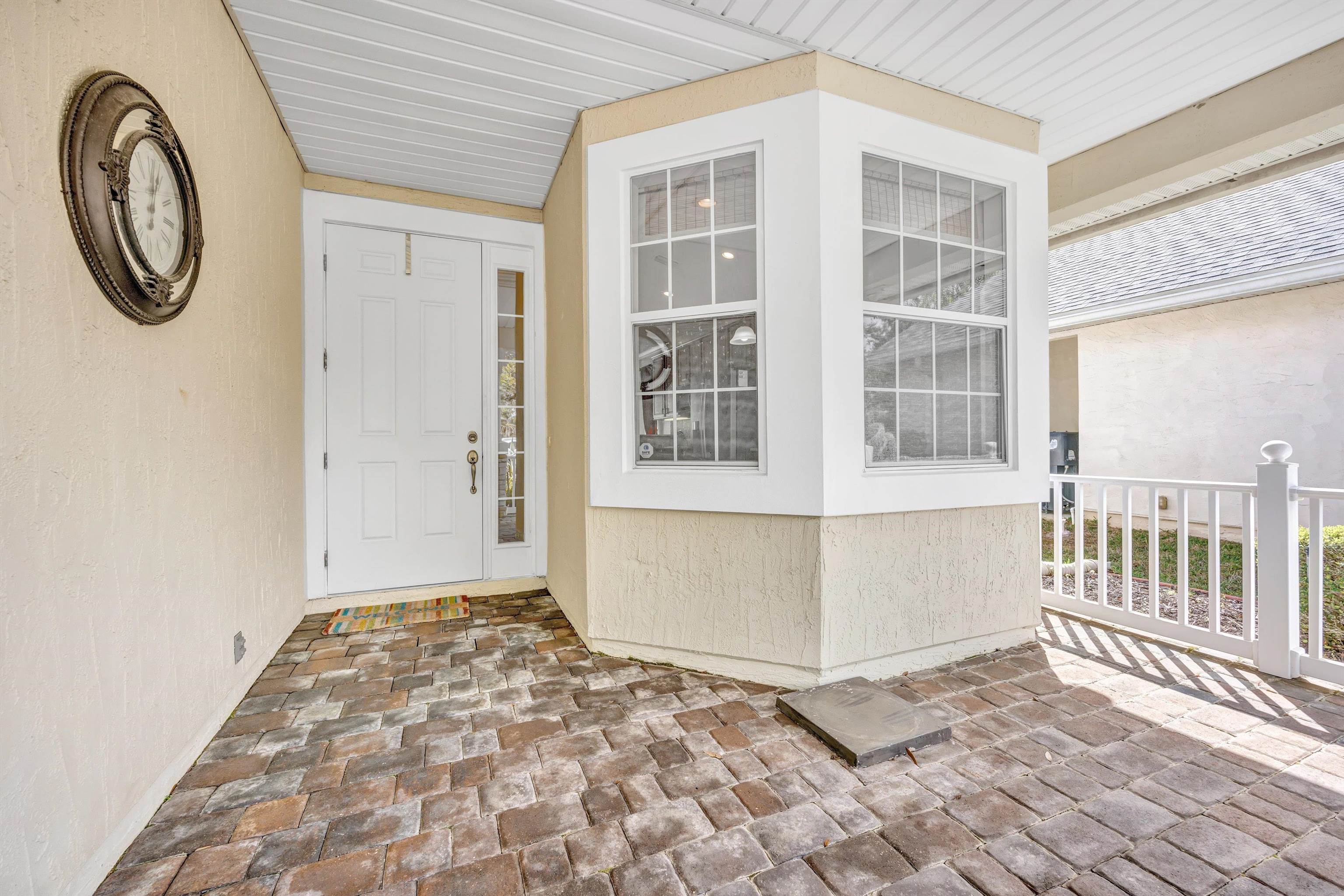 608 Copperhead Circle St. Augustine, FL 32092 - Photo 6 of 65 Fully paved, private covered porch with double tiered fountain