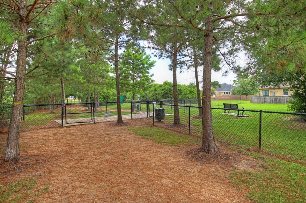 15 White Meadow Court Spring, TX 77379 - Photo 37 of 43 2.5 acre fenced dog park with agility equipment and both large and small dog sections. Water fountians for the pups, too!