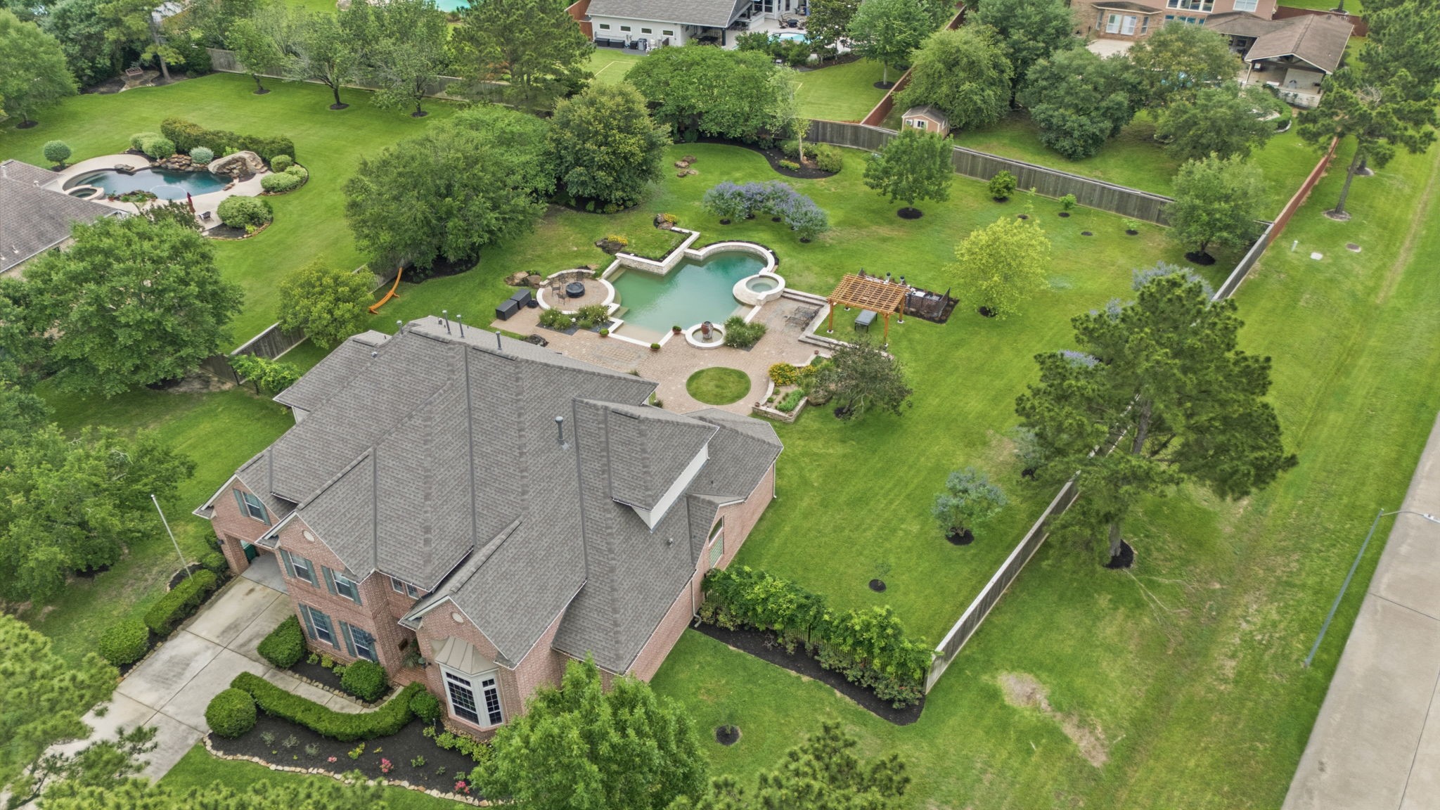 15 White Meadow Court Spring, TX 77379 - Photo 8 of 43 2024 full roof replacement. Lot also has full underground sprinklers.