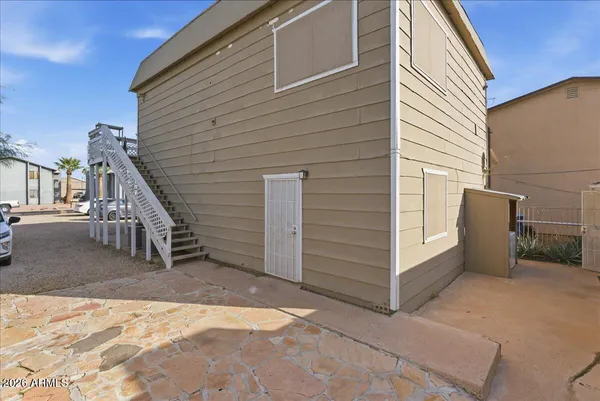 a view of a house with a backyard