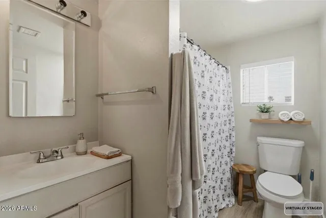 a living room with furniture window and a table