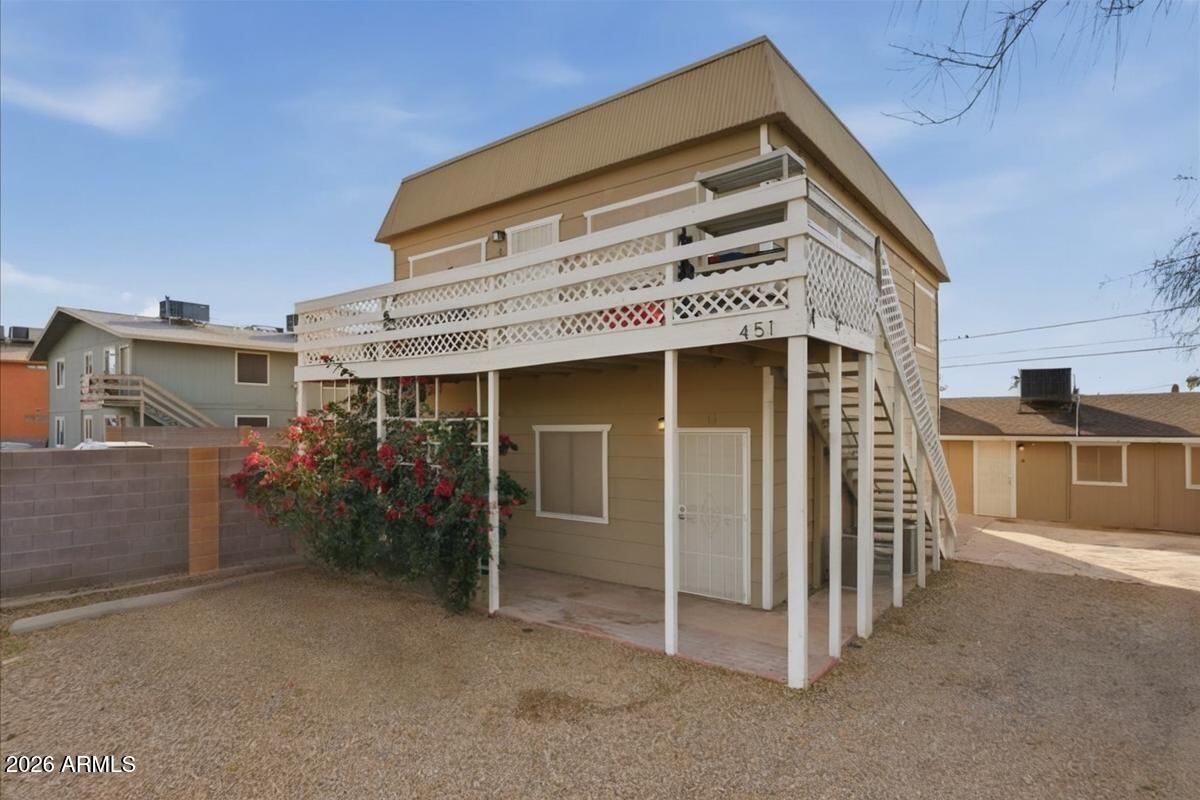 451 East 10th Avenue Apache Junction, AZ 85119 - Photo 4 of 21 a front view of a house with parking space