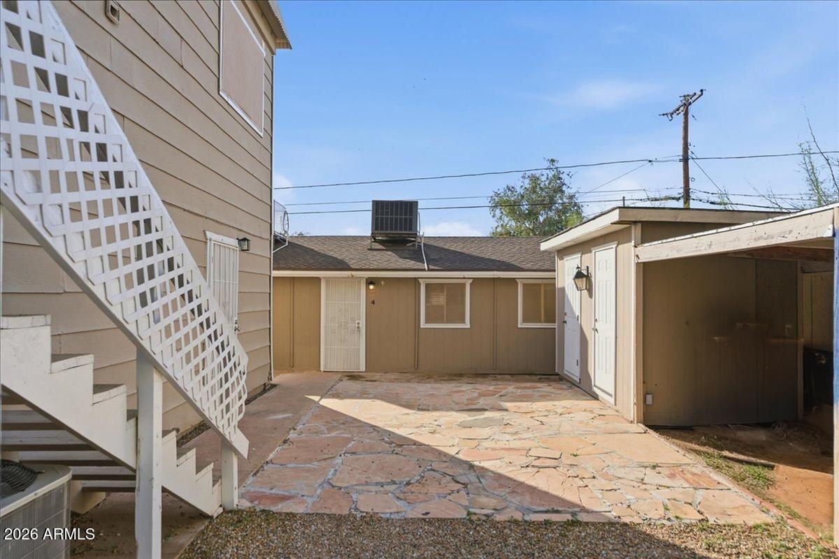 451 East 10th Avenue Apache Junction, AZ 85119 - Photo 5 of 21 a front view of a house with a yard