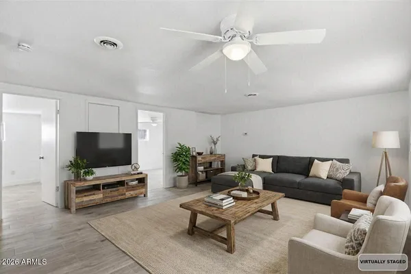 a living room with furniture and a flat screen tv