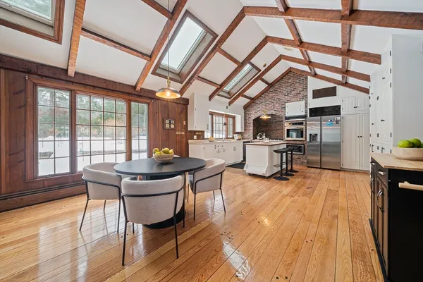 a view of a dining room with furniture window and wooden floor