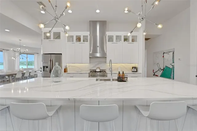 a view of a workspace with furniture and a flat screen tv