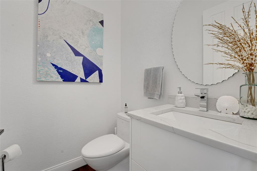 5911 Old Berkley Road Auburndale, FL 33823 - Photo 28 of 91 a bathroom with a toilet sink and mirror